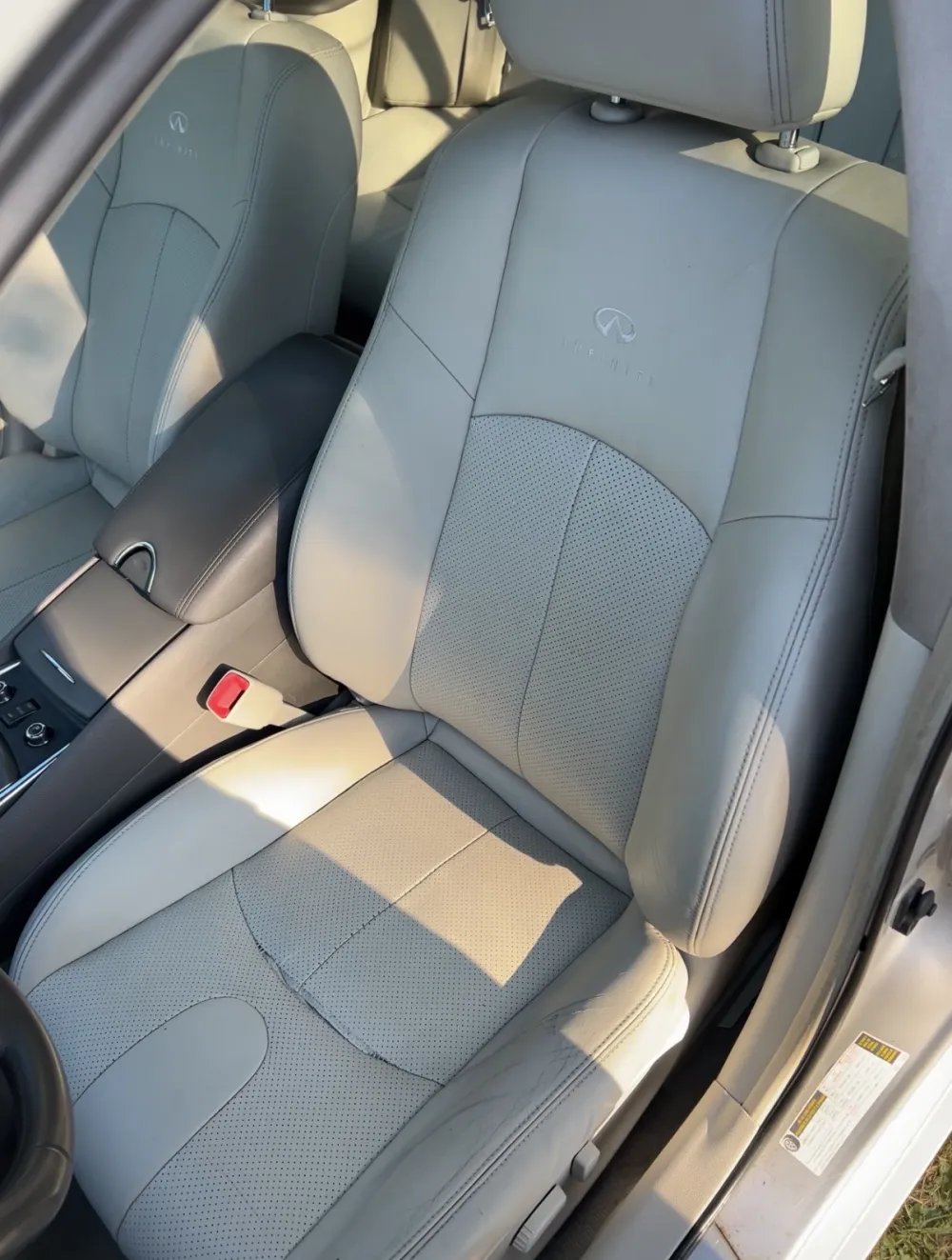 Clean, restored Infiniti leather front seat after detailing