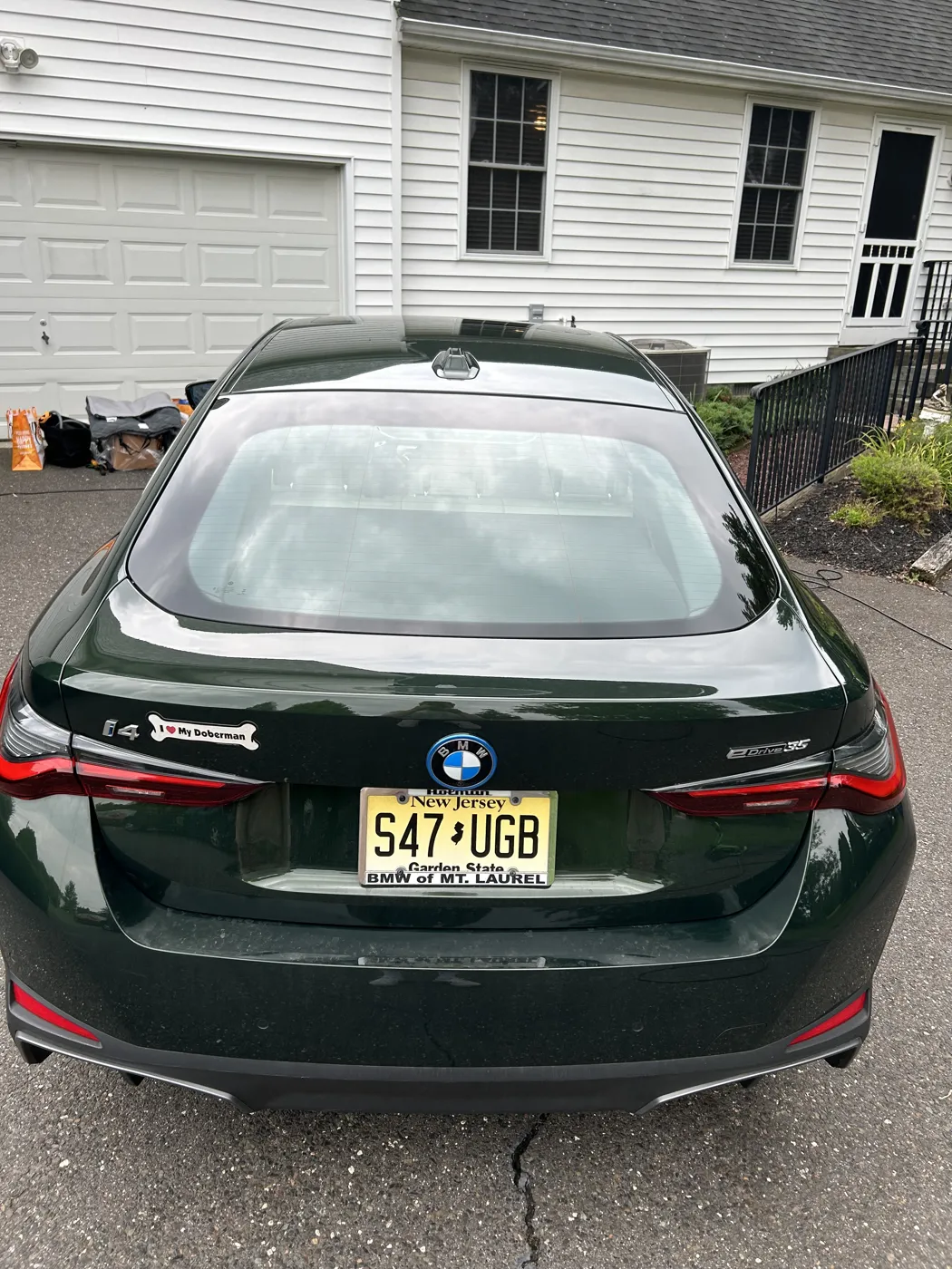 Detailed BMW i4 rear three-quarter, deep gloss