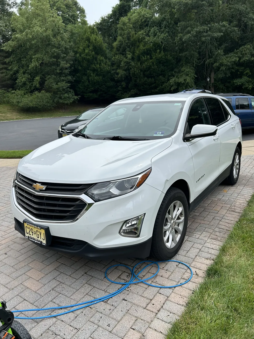 Freshly detailed white SUV with a deep glossy finish